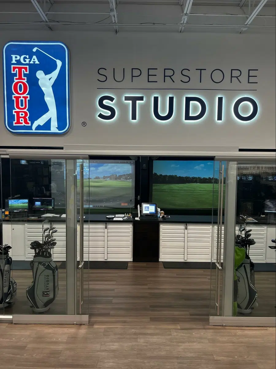 pga tour superstore studio opening with hitting bays behind