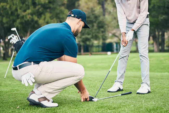 Teaching-golf-lesson-and-sports-coach-help-man-wi-2023-03-24-00-34-06-utc
